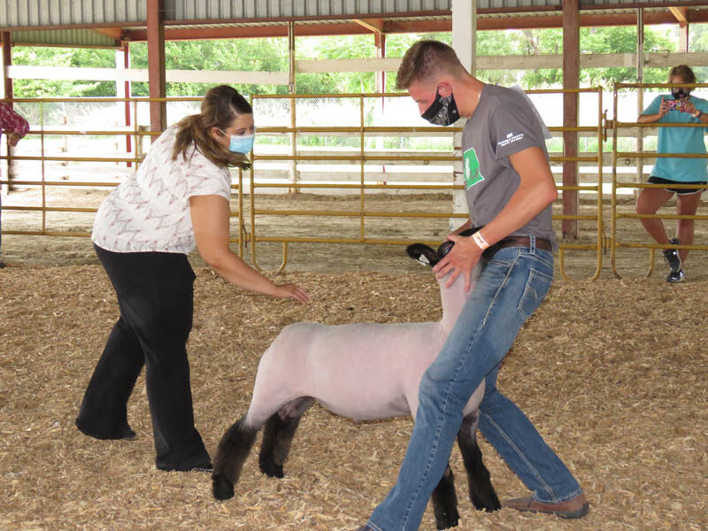 Sheep reserve grand champion, Tanner Kircchoff, Kearney, judge Kinsey Freeman, Aurora
